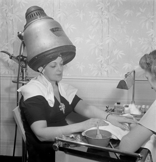 kvetchlandia:Marjory Collins     Woman Getting a Manicure While Her Hair is Drying, F