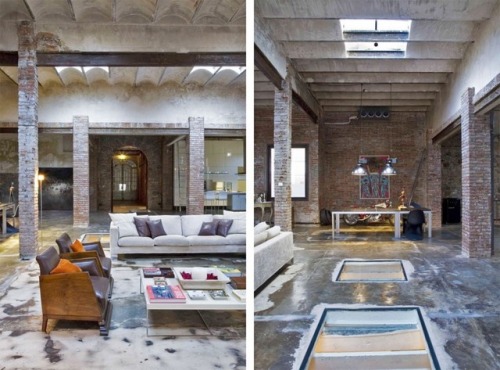 this modern loft in Barcelona uses brick walls and bare piping to create an industrial feel