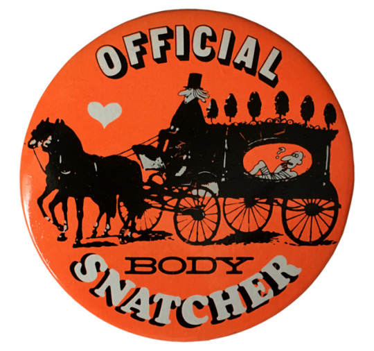 an orange button with someone riding a horse-drawn carridge with a confused person inside, and text reading 'OFFICIAL BODYSNATCHER'