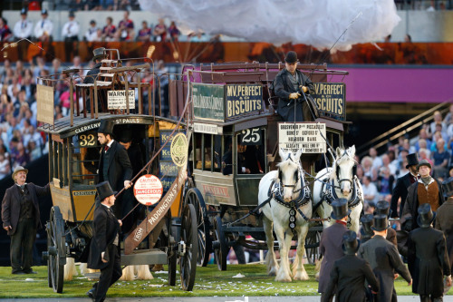 London 2012 Olympic opening ceremony: horse-drawn omnibuses enter the stadium as the Green and Pleas