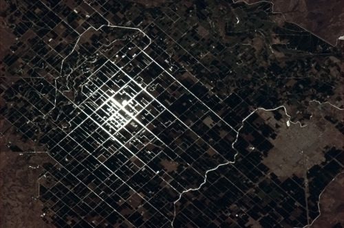 colchrishadfield: Sunglint catches the irrigation canals of these Mexican farmers.