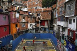 nubbsgalore:  the other football being played in brasil. photos from rio’s favelas by (click pic) pilar olivares, mario tama and felipe dana (see also: previous brasil posts) 