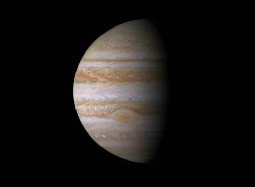 Jupiter is perpetually covered with clouds composed of ammonia crystals and possibly ammonium hydros