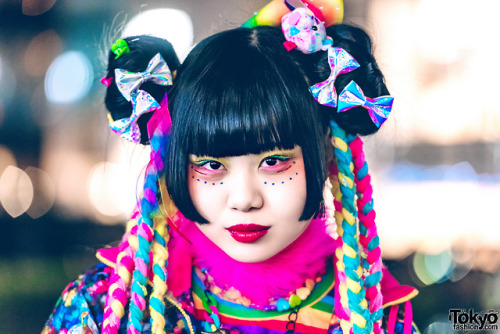 Japanese art student Chami on the street in Harajuku wearing a super colorful kawaii look with items