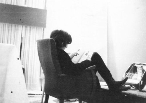 George Harrison reading what looks like a magazine at Gaumont Cinema, Southampton, England. (Nov. 19