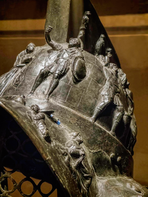 Myrmillo-style bronze gladiator helmet with bas-relief depicting scenes from the Trojan War Herculan