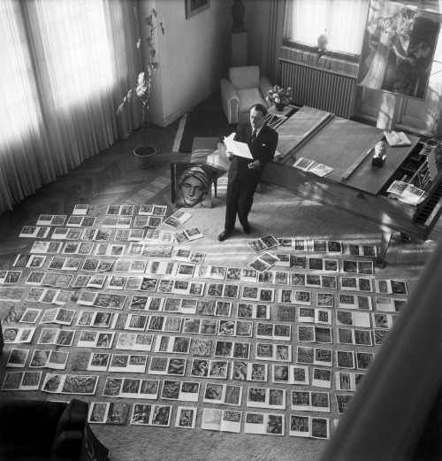 Maurice Jarnoux, André Malraux selecting Photographs for the Imaginary Museum, 1947