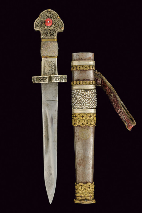 Chinese dagger decorated with brass, silver, and cabochon, circa 1900.from Czerny’s International Au