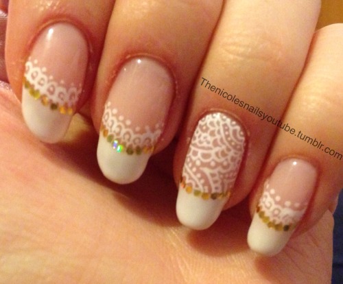 My lace design french manicure with gold glitter placement.