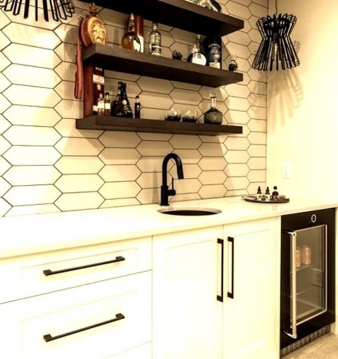 Underground BasementExample Of A Large Minimalist Underground Carpeted, Beige Floor And Wallpaper Basement