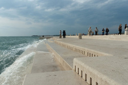 snovolovac:  sixpenceee:  The Sea Organ is situated on the western end of Zadar´s Riva, and can be observed as several stairs that descend into the sea.The organ looks like a series of broad steps leading down into the water, but there´s actually very