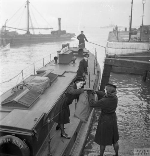 WRNS with the Fleet Mail (England, November 1944):Just visible through the grid of sorting compartme