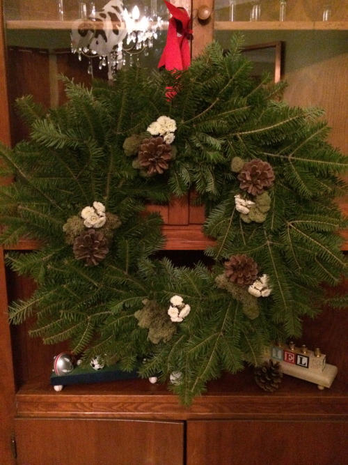 Christmas wreath: pine, pinecones, button mums, moss.