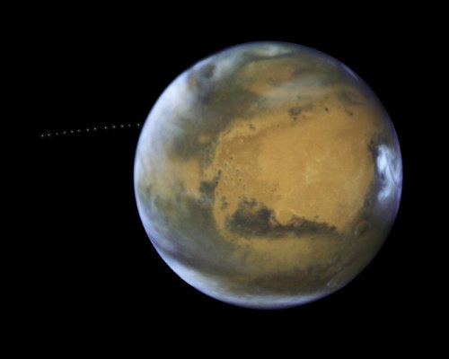 space-pics:Martian Moon Orbiting the Red Planet by NASA Hubble