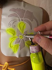 tribaltattooscollection: Usingairbrush temporary tattoo body paint fluoro yellow apply an, Read More