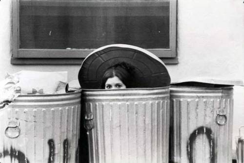 greenchimneys:Carrie Fisher hiding in the trash cans on the backlot of the Star Wars set. 