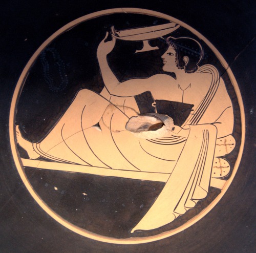 This Greek kylix from 510 BCE depicts a man playing Kottabos. Kottabos was a drinking game played by