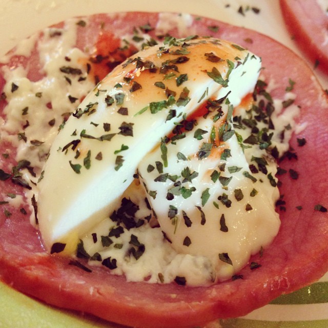 Awesome snack for 135 calories! 3 sliced of Canadian bacon, 1 hard boiled egg white (split in thirds), 1 T whipped chive cream cheese (and I had a small sliver of Steve’s laughing cow Swiss cheese he had left over), cilantro and a splash of hot...