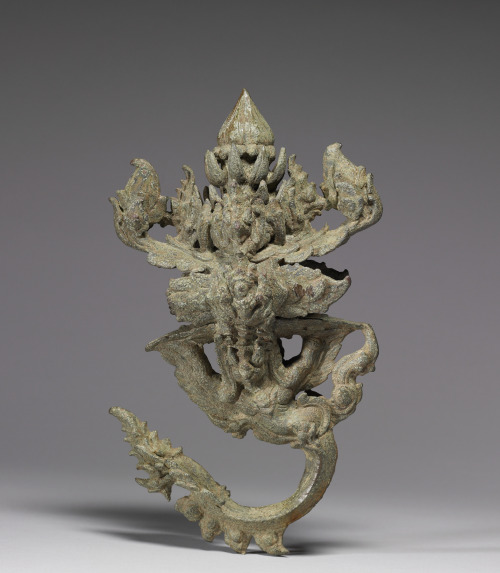 Palanquin hook from Cambodia, depicting a floral bud surrounded by heads of the mythical bird Garuda