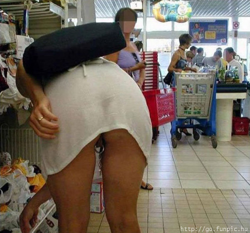 carelessnaked:Inside a shop in a short dress and showing her pussy and pussy ring