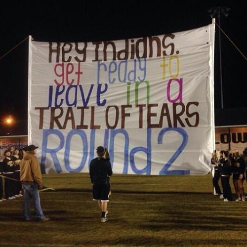 oreides:bloodylikestars:embrace-your-earth:blackinasia:(Image description: football banner being hel