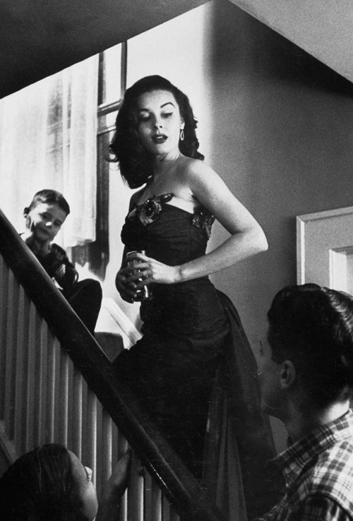  Elaine Stewart recreating a scene from a movie she acted in to entertain her family,