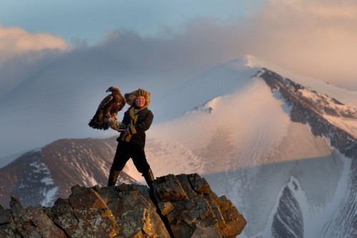 13 year old Mongolian huntress Ashol Pan and her golden eagle.Photos by Asher Svidensky