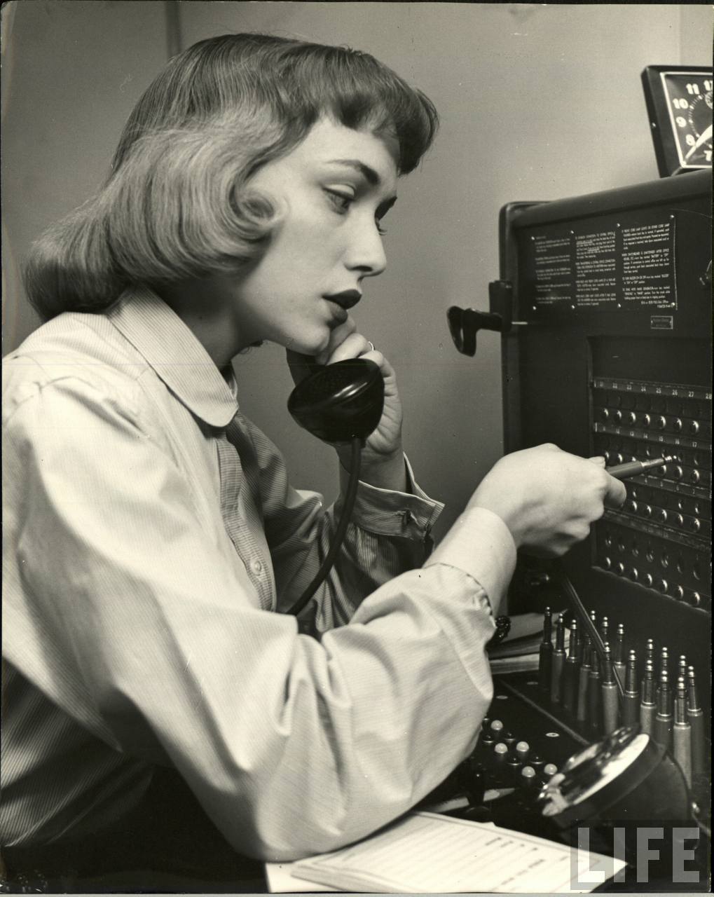 Actress working as a switchboard operator between shows (Nina Lean. 1954)