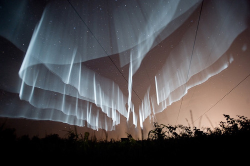 culturenlifestyle:  Rare White Curtain Auroras Seen Over FinlandBehold stargazers, this is not an art installation. These are actually stunning white Northern Lights in Finland. The stunning  Aurora Borealis resemble a white curtain, which seems to be