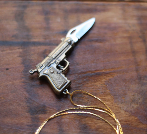 wickedclothes: Gun Pocketknife Necklace Crafted out of brass, this pistol pendant unfolds to reveal 