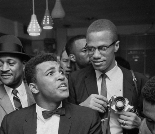 twixnmix:  Muhammad Ali celebrating with Malcolm X at the Hampton House in Miami after he won the Wo