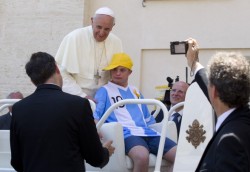 The pope let a young guy with down syndrome