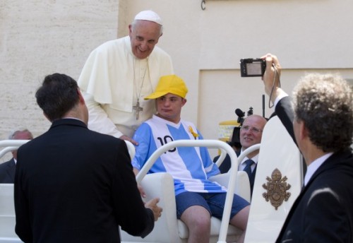 The pope let a young guy with down syndrome adult photos