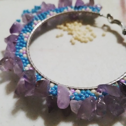 Pretty hoops made with seed beads and amethyst chips. Making its mate. They will be $45 plus shippin