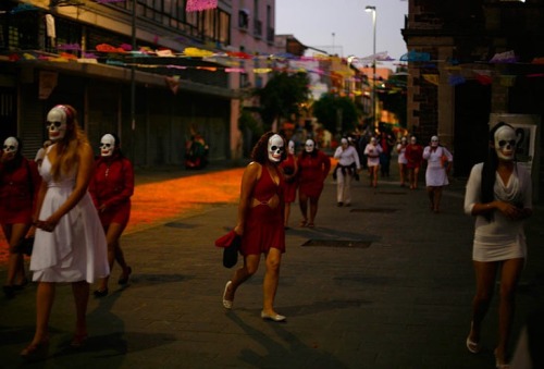 selectivesight:  Sex workers wearing skeleton masks gather in Mexico City for a procession to remember their deceased colleagues, in particular those violently murdered in the past few years, two days before the Day of the Dead festival when Mexicans