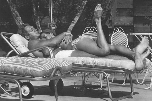 Steve McQueen and Neile Adams by the pool, 1963.Photographer: John Dominis