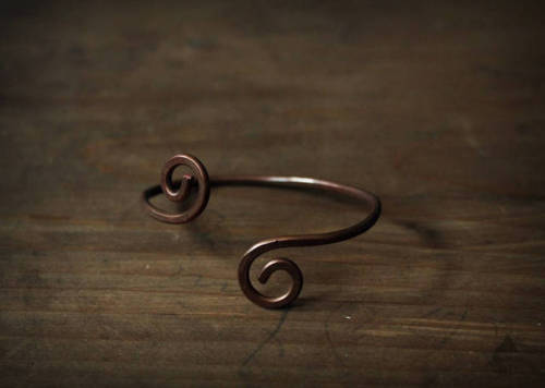  One-of-a-kind handmade copper bracelet. The bracelet is handcrafted from pure copper wire and artif