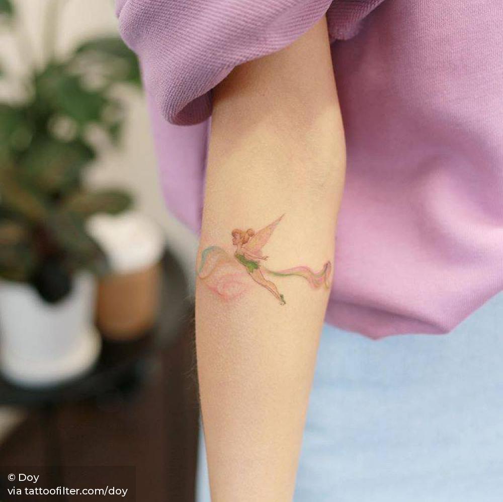 Tinker Bell tattoo located on the ankle.