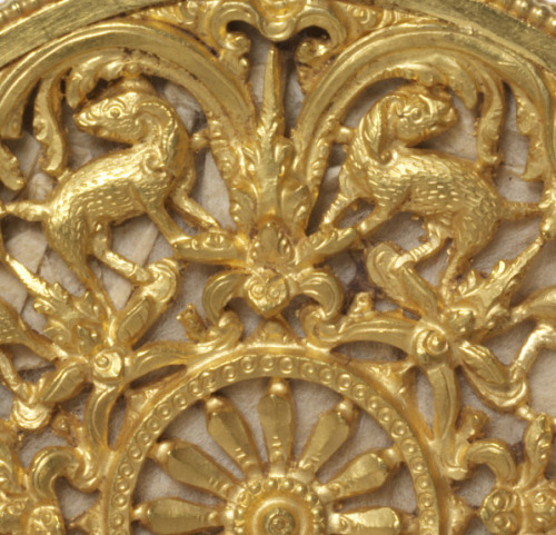Earplug Disc, 14th century. Diameter 3 inch. Unknown artist. Gold repousse. East Java. Via V&amp;ADi