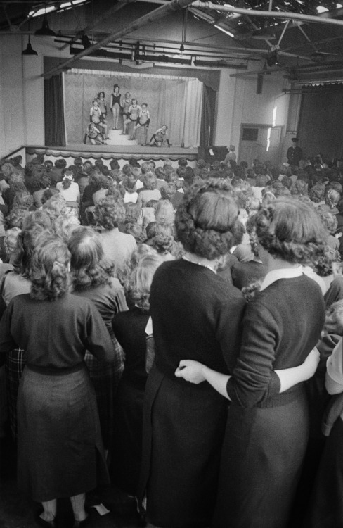  An audience of women watching a group of chorus girls performing on stage John Chillingworth, “The 