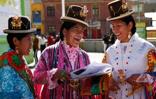 Aymara women smile during the Miss Cholita 2013 beauty pageant in La Paz, Bolivia on June 30, 2013. 