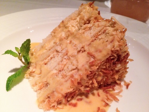 Toasted coconut layer cake with crème anglaise from Mesa Grill via AmuseBoucheBlog.com
