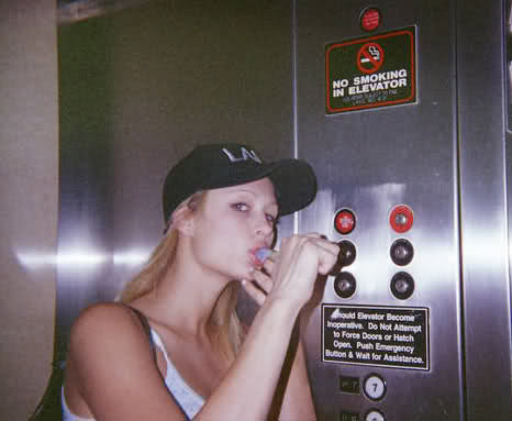 parisexposed:Paris smokes a bowl in an elevator.