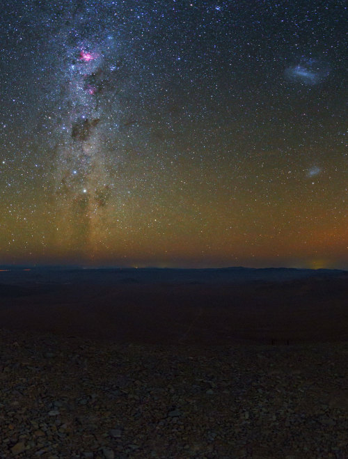 astronomicalwonders:  Night over the Atacama Desert near ESO A view from the Chilean Atacama Desert, showing the Milky Way shining brightly overhead. In the background, the quiet beauty of the Atacama sky is enhanced by a orange/yellow aurora-like shimmer