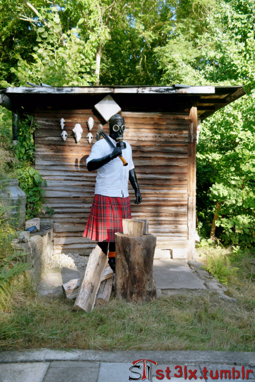 The Rubber Highland Games 2018 - Part 6 of 7Rubbered husband chopping wood in the garden