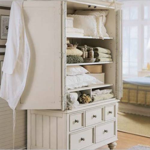 A beautiful white armoire.