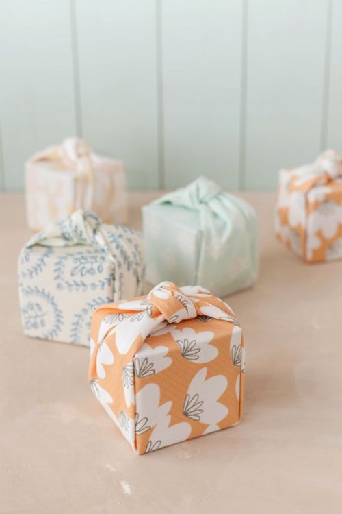 DIY Knotted Fabric Gift Wrap Tutorial from Julep. This tutorial only requires 2 cuts to create this 