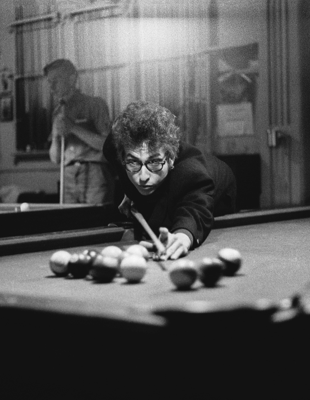 vaticanrust:  Bob Dylan shooting pool in Kingston, New York, 1964.  Photo by Daniel