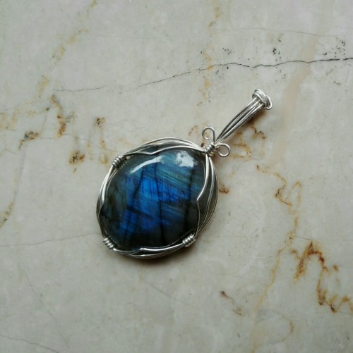 This is the same labradorite pendant just with different angles of light. Labradorite is truly amazi