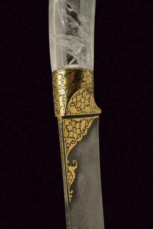 art-of-swords:  Kard Dagger Dated: late 19th century Culture: Indian Medium: steel, rock crystal, gold, iron Measurements: overall length 30.5 cm The dagger has a straight, single-edged blade of damask steel, decotated with koftgari gold inlays depicting